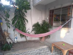 a hammock hanging from the side of a house at Pousada Brasil Recife in Recife