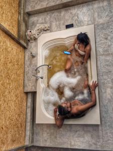 a picture of a man in a bath tub at Glamping el Porvenir RNT 10601 in Manta