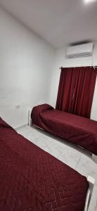 Ένα ή περισσότερα κρεβάτια σε δωμάτιο στο La Perla