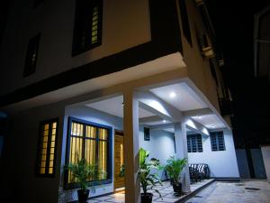 a house with plants in front of it at night at LV-21 Service Apartment MO4a in Lagos