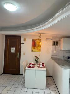 a kitchen with a counter with some food on it at Apto amplo no Renascença in São Luís +2 photos