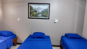 Кровать или кровати в номере Cabinas Marylu Antigua Cabinas Permont
