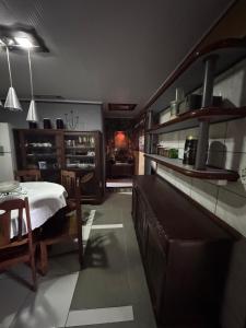 a kitchen with a table and a dining room at Casa da Oma in Blumenau