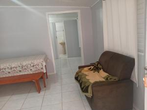 Posezení v ubytování Kitnet de férias