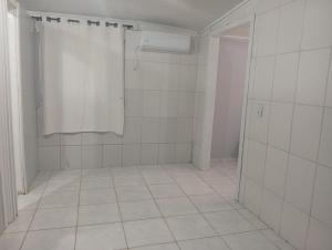 Koupelna v ubytování Kitnet de férias + 5 fotografií