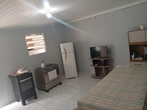 Kuchyň nebo kuchyňský kout v ubytování Kitnet de férias