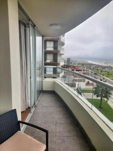 a balcony with a view of a city at Departamento con Vista al Mar in Lima
