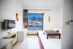 Μια τηλεόραση ή/και κέντρο ψυχαγωγίας στο Xuegu Nannan B&B