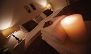 a person laying on a bed in a room at Z alal Hotel in Jeddah