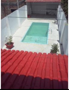 a swimming pool on the roof of a house at Beautiful House - COP30 in Belém