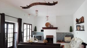 a living room with a couch and a fireplace at Quinta Santa Ana in Setúbal