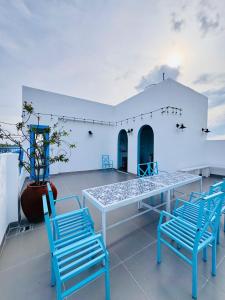 a table and chairs on the roof of a building at Ivory Blue Ninh Chử in Tan An +27 photos