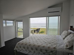 Ένα ή περισσότερα κρεβάτια σε δωμάτιο στο Beach house