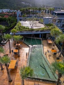 an overhead view of a courtyard with a fountain at Luxury 1BR Resort Retreat by IBG Property P514 in Kamala Beach