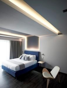 Postel nebo postele na pokoji v ubytování Tesoro Blu Hotel & Spa Adults Only