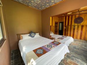 a room with two beds in a room at Quế Homestay in Hòa Bình +127 photos