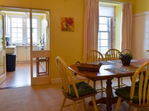 a kitchen and dining room with a table and chairs at St Abbs - Lighthouse Retreat in Saint Abbs