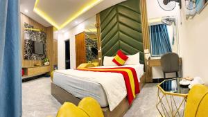 Postel nebo postele na pokoji v ubytování GRAD Queen Urban Mo Lao