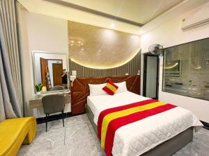 Postel nebo postele na pokoji v ubytování GRAD Queen Urban Mo Lao