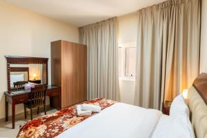 Postel nebo postele na pokoji v ubytování Royal Tulip - One Bedroom Apartment