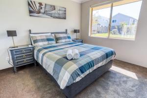 Ένα ή περισσότερα κρεβάτια σε δωμάτιο στο Marine Holiday Home - Geographe