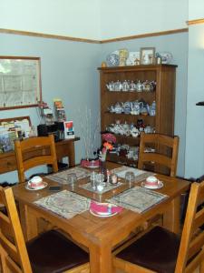 a wooden table with chairs and a dining room at Bridge House Bed & Breakfast in Newark upon Trent