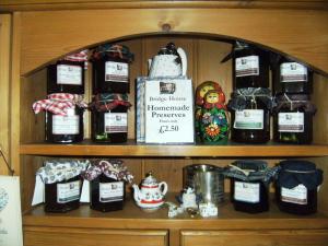 a shelf with a bunch of bottles of wine at Bridge House Bed & Breakfast in Newark-on-Trent