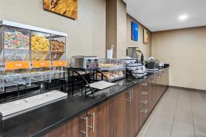 a bakery with a counter with pastries on it at Comfort Inn Chambersburg North in Chambersburg