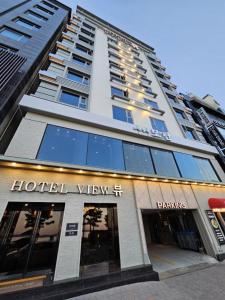 a building with a hotel view on a street at Pohang Hotel View in Pohang