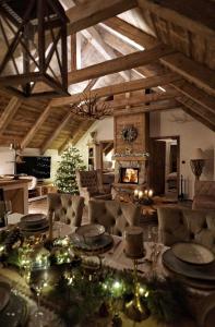 a living room with a table with christmas lights at Deer Apartment in Lipí