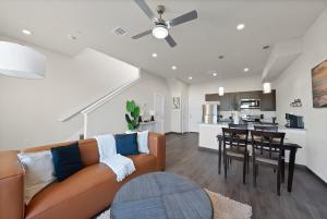 a living room with a couch and a table at Luxury 2BR Getaway Near Stadiums and Texas Live in Arlington