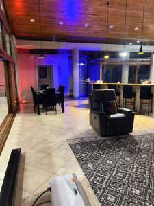 a living room with a couch and a table at Luxurious Rainforest Retreat in Drake Bay, Osa, Costa Rica in Drake
