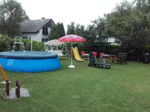 a backyard with a play area with an inflatable at János Nyaraló in Balatonmáriafürdő