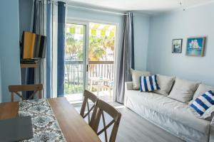 a living room with a couch and a table at Apartment Las Americas in Playa de las Americas