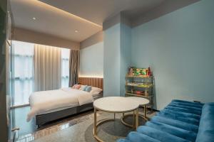 Giường trong phòng chung tại Yueta E-sports Hotel (Haizhu South of Pearl River)