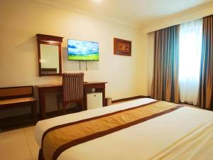 Postel nebo postele na pokoji v ubytování Hotel Yasmin