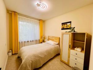 Ένα ή περισσότερα κρεβάτια σε δωμάτιο στο Spacious and Cozy 3BR Apartment, UB Downtown +21 φωτογραφίες
