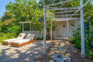 a patio with a couch and a pergola at Akdeniz Bahçesi Apart Hotel by Kimera Lounge in Cıralı
