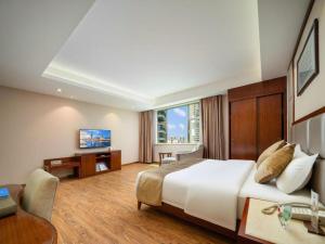 TV a/nebo společenská místnost v ubytování Zhonglian Harbor Hotel