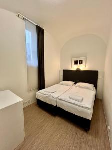 Postel nebo postele na pokoji v ubytování Prague Central Residence