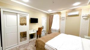 Μια τηλεόραση ή/και κέντρο ψυχαγωγίας στο Hotel Butique Biluri S
