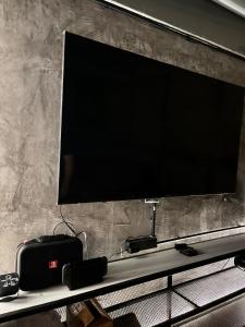 a flat screen tv on top of a shelf at bonheurhousebetong in Betong +3 photos