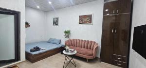 a small room with a couch and a small table at Bu studio 46 Nam Ngư in Hanoi