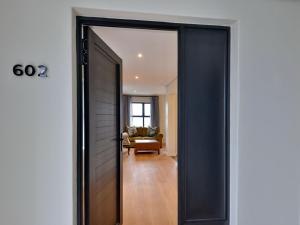 an open door to a room with a living room at Hilton Homestead by ANEW in Hilton