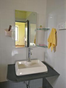 Ένα μπάνιο στο Dr Halkarnikar Bungalow