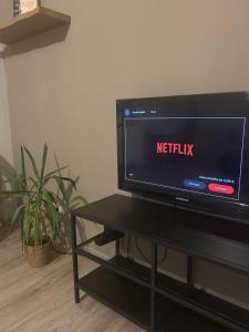 a flat screen tv sitting on top of a table at Ferienwohnung am Eifelsteig in Üxheim