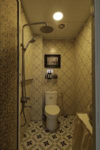 a bathroom with a toilet and a shower at Langmandi Experience Ấu Triệu in Hanoi +71 photos