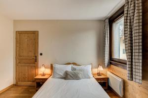 Voodi või voodid majutusasutuse APARTMENT STADDON - Alpes Travel - Central Chamonix - Sleeps 4-6 toas +32 fotot