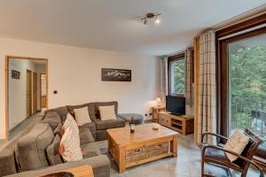 Televiisor ja/või meelelahutuskeskus majutusasutuses APARTMENT STADDON - Alpes Travel - Central Chamonix - Sleeps 4-6