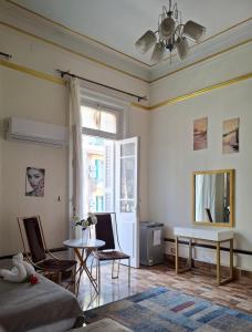 a bedroom with a bed and a table and a window at Pa la ce court in Cairo
